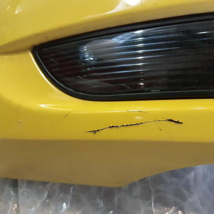 Large scrape in yellow bumper